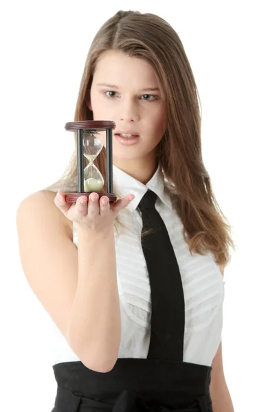 stock image Young businesswoman with hourglass - time concept