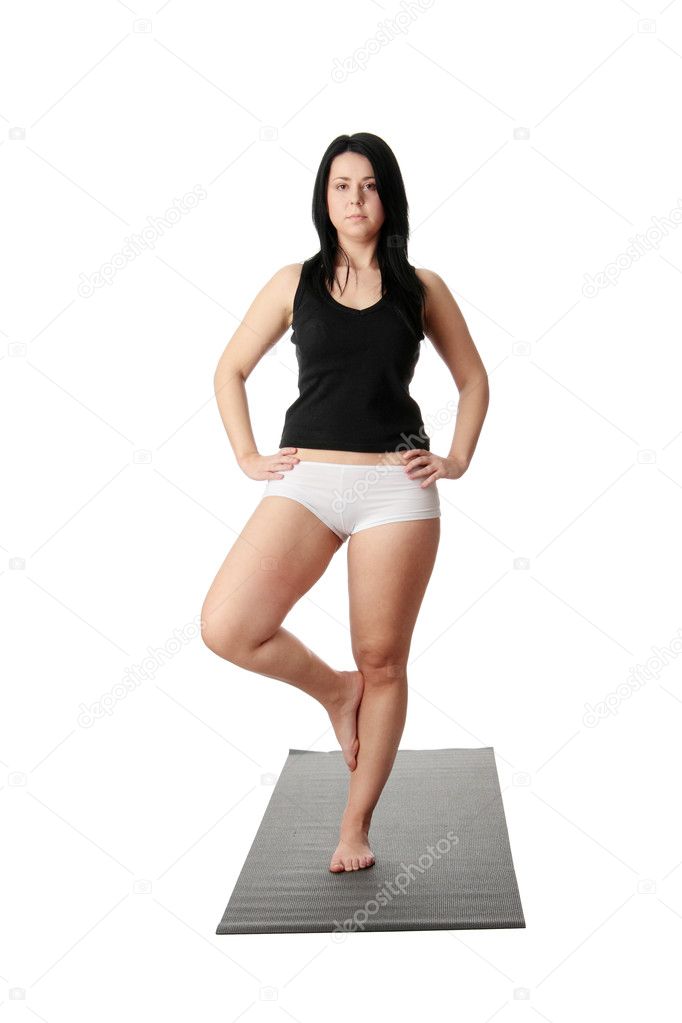 Corpulent woman training yoga