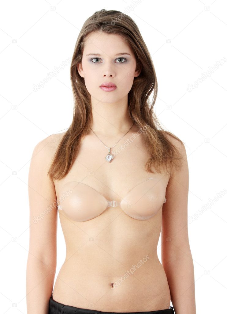 Young beautiful caucasian woman in silicon bra, isolated on white