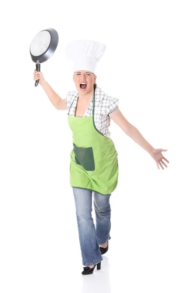 Boos jonge vrouw koken — Stockfoto