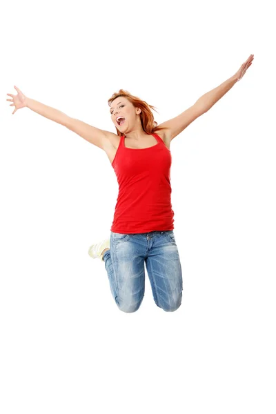 Joven mujer caucásica feliz saltando en el aire —  Fotos de Stock