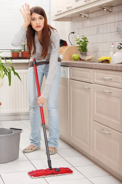Woman holding a mop — Stock Photo, Image
