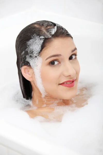 Young woman taking bath — Stock Photo, Image