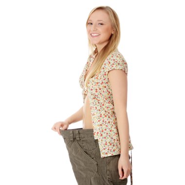 Woman showing how much weight she lost clipart