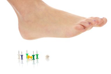 Female foot above pushpin clipart