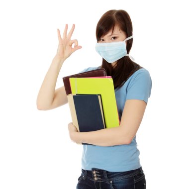 Young caucasian student woman with mask on her face. clipart