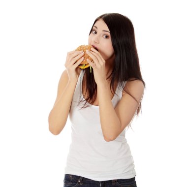 Woman eating hamburger clipart