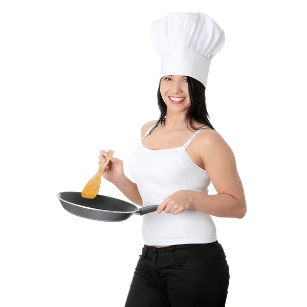 Mujer joven cocinando comida saludable — Foto de Stock
