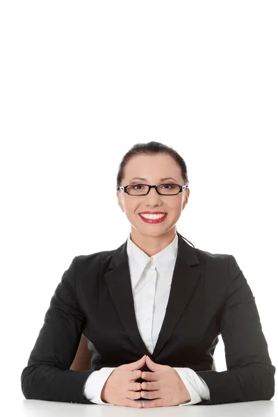 Young happy businesswoman behind the desk — Stock Photo, Image