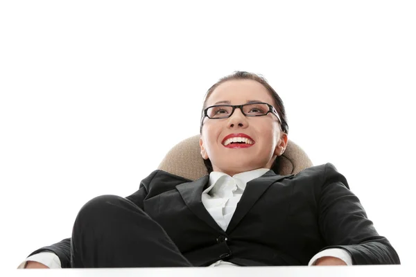 Young businesswoman relaxing at the desk — Stock Photo, Image