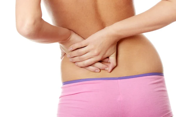Pain in her back — Stock Photo, Image