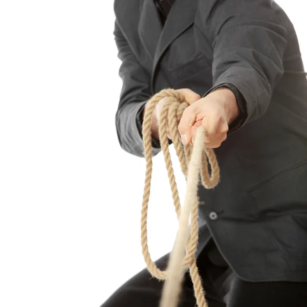 Бизнесмен тянет за веревку — стоковое фото