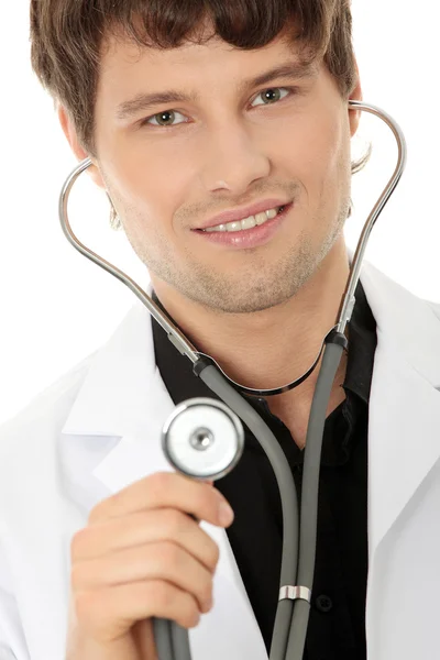 Schöner junger Arzt mit Stethoskop — Stockfoto