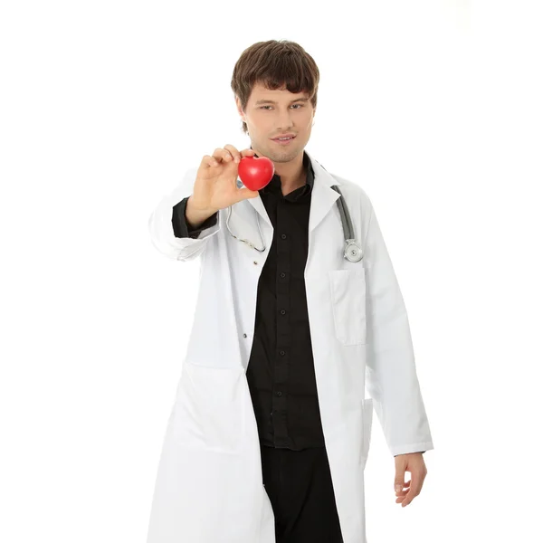 Γιατρός που κατέχουν καρδιά σχήμα παιχνίδι — Φωτογραφία Αρχείου