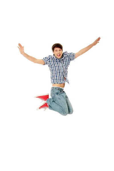 Junger glücklicher Kaukasier springt in die Luft — Stockfoto
