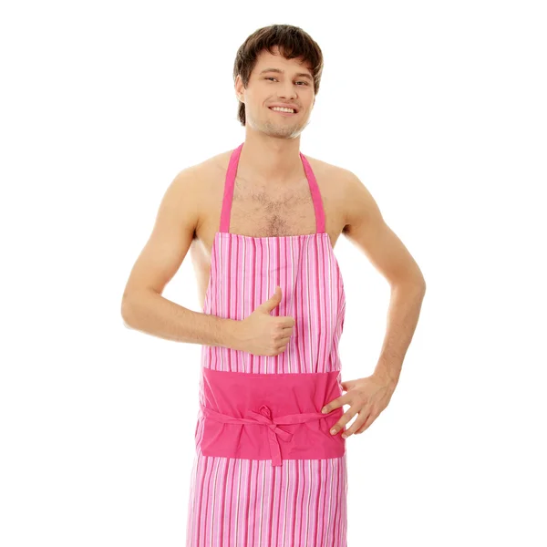 Naken man wering rosa förklädet — Stockfoto