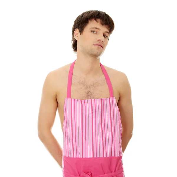 Nu homem respondendo avental rosa — Fotografia de Stock