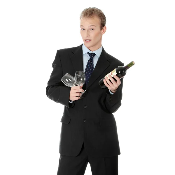 Young handsome businessman with bottle of wine — Stock Photo, Image
