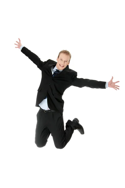 Молодой кавказский бизнесмен прыгает — стоковое фото
