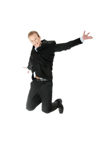 Young happy caucasian businessman jumping — Stock Photo, Image