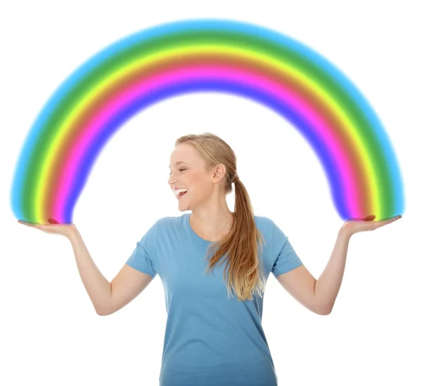 Young woman holding rainbow — Stock Photo, Image