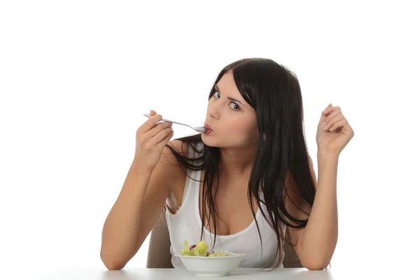 Ragazza mangiare insalata — Foto Stock