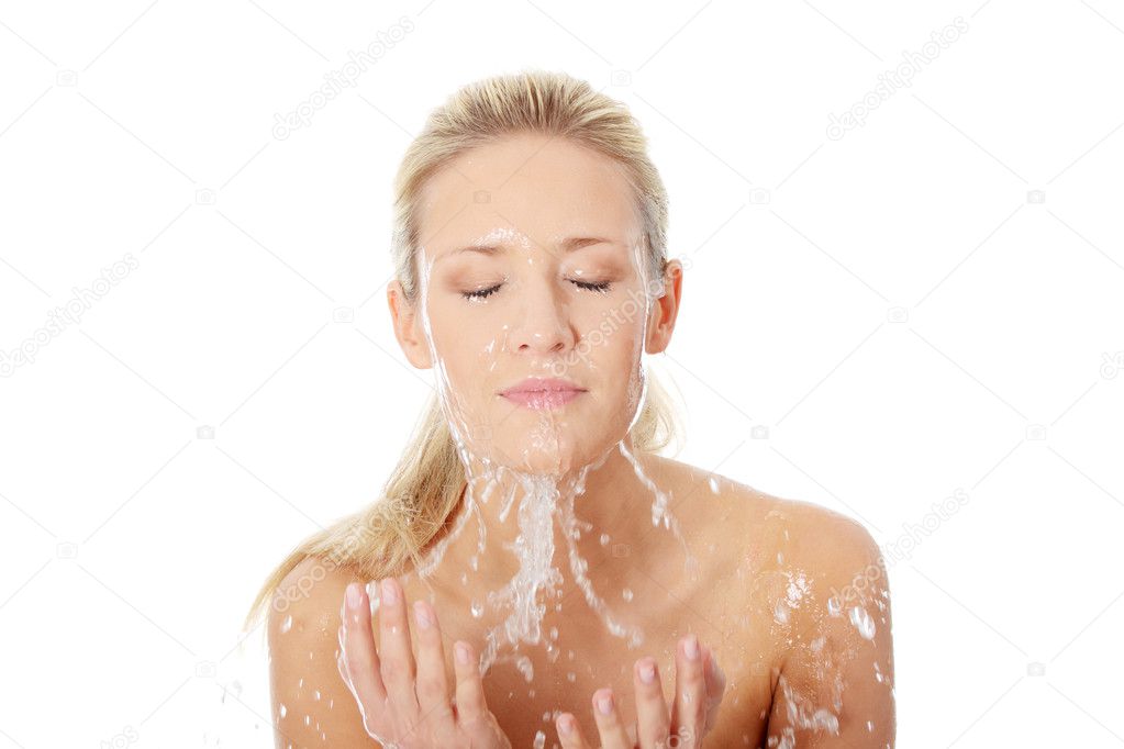 Female washing her face