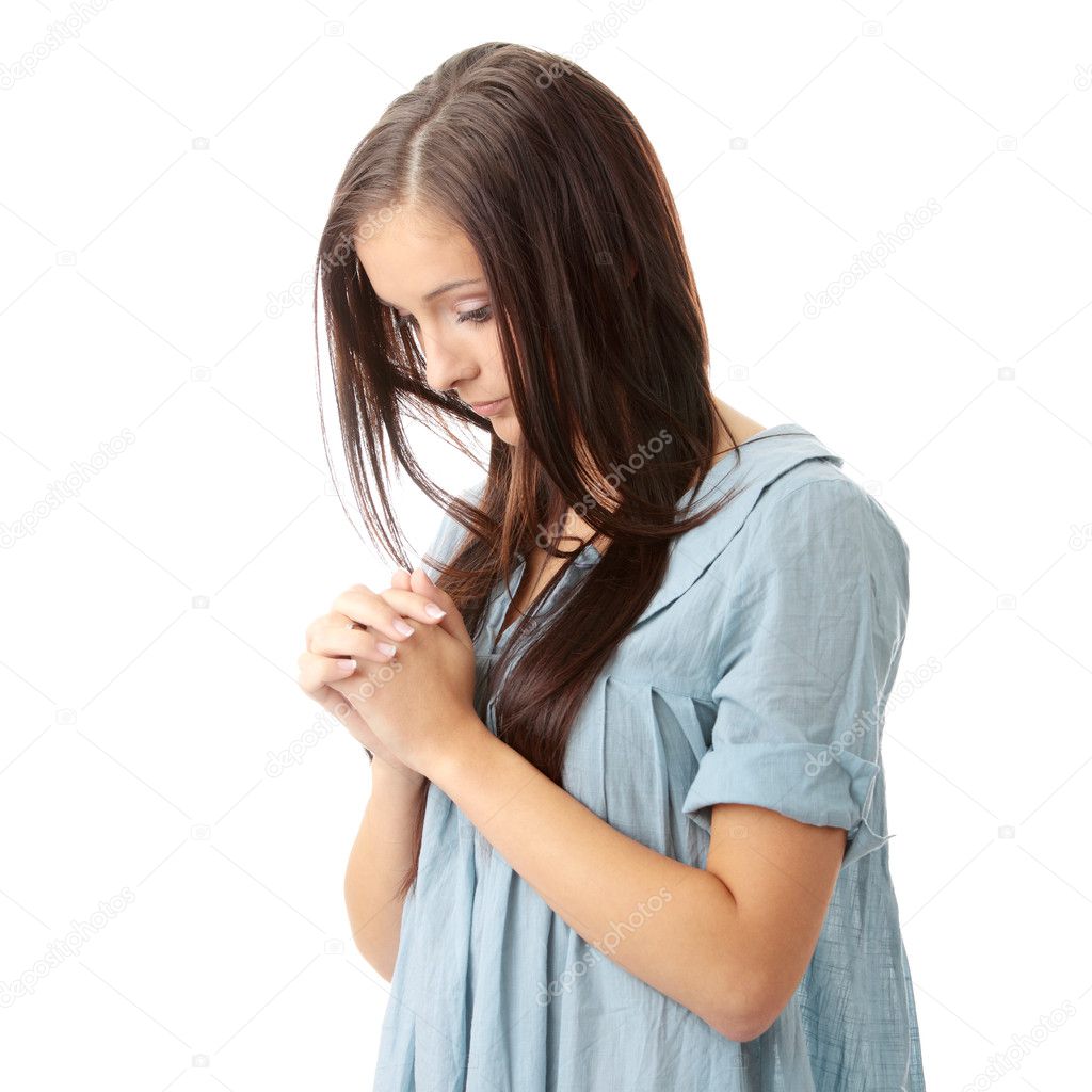 Young caucasian woman praying