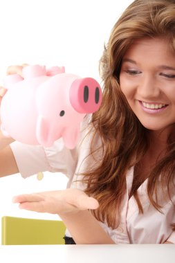 Woman and piggy bank