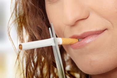 Young woman quiting smoking clipart