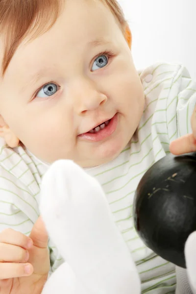 Baby girl with small green pumpkin — Stock Photo, Image