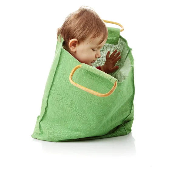 Menina bebê em saco de compras — Fotografia de Stock