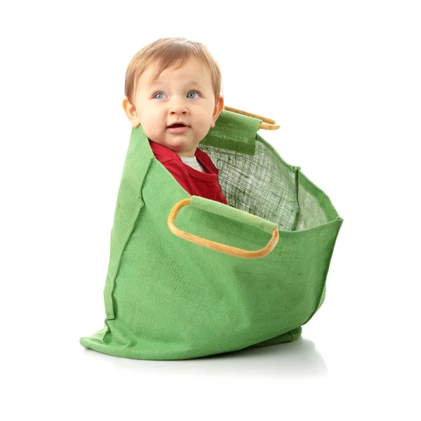 Bebé niña en bolsa de compras — Foto de Stock