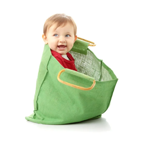 Baby girl in shopping bag — Stock Photo, Image