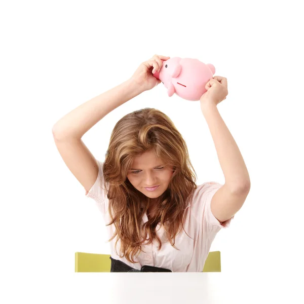 Woman and piggy bank — Stok fotoğraf