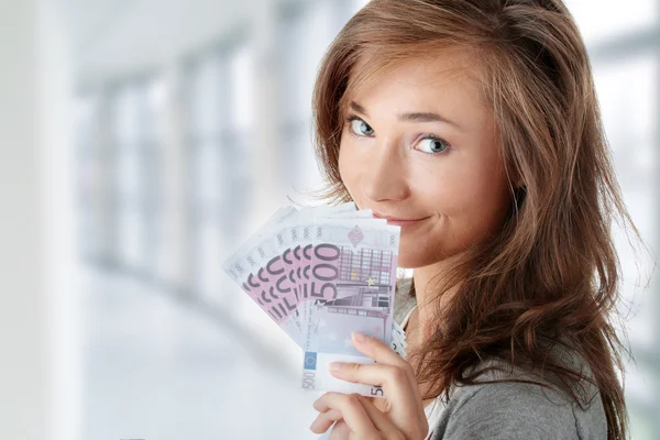 Woman holding euros bills — Stock Photo, Image