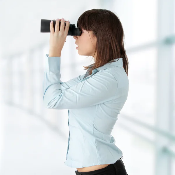 Business woman looking through binocular — Stock Photo, Image