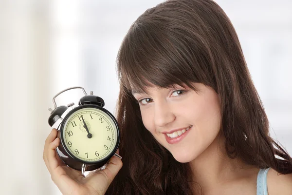 A teen woman with alarm clock — Stock Photo, Image