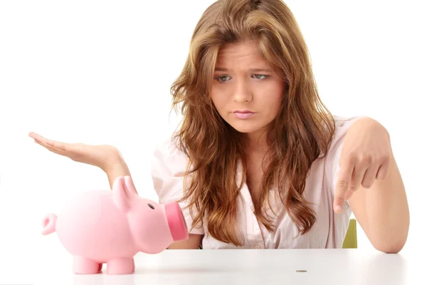 女人和猪存钱罐 免版税图库图片