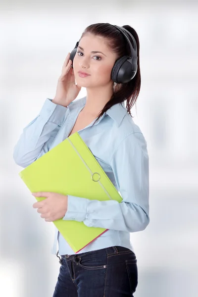 Happy student girl listening to the music Stock Photo