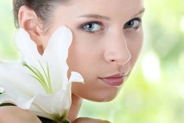 Portrait of Fresh and Beautiful woman with flower Stock Photo