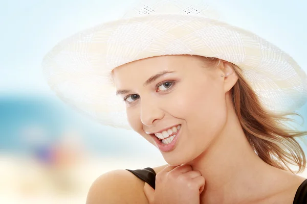 Beautiful woman in swimsuit and hat — Stock Photo, Image