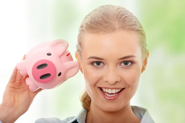 Businesswoman with piggy bank — Stock Photo, Image