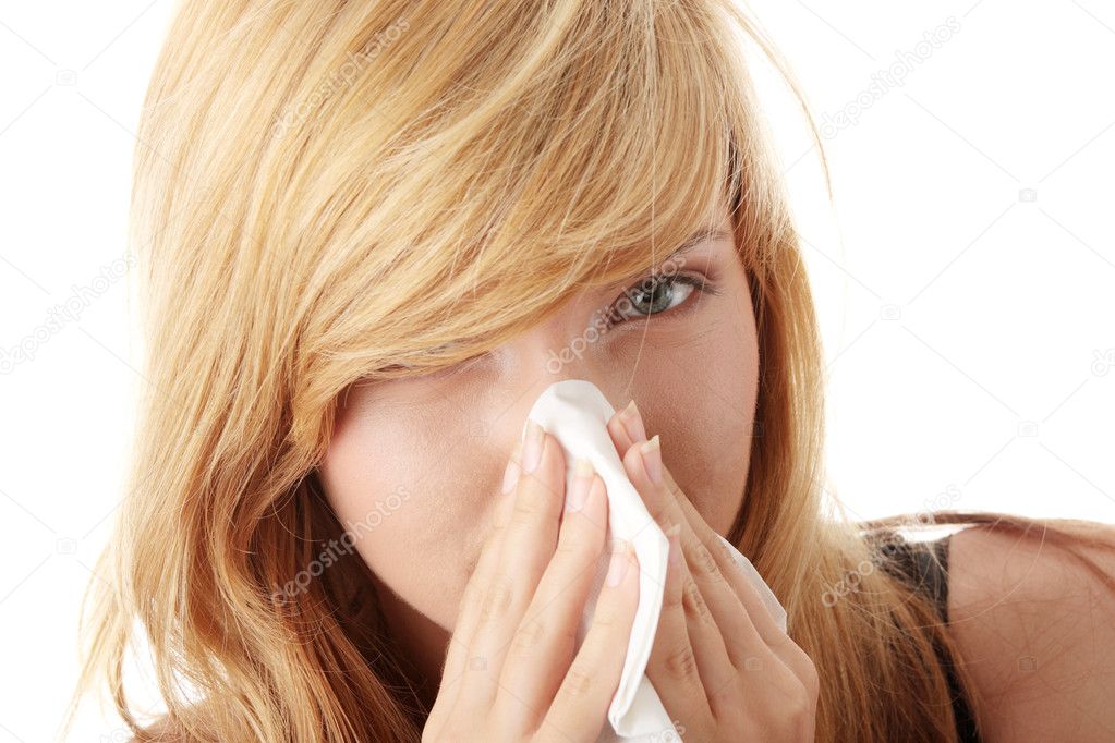 Young blonde woman having a cold