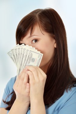 Teen woman with dollars.