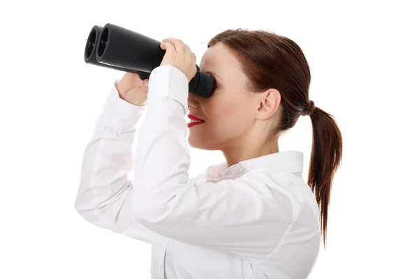 Businesswoman looks threought binoculars — Stock Photo, Image