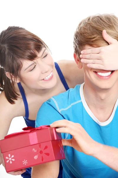 Girl give a gift to her boyfriend Stock Image