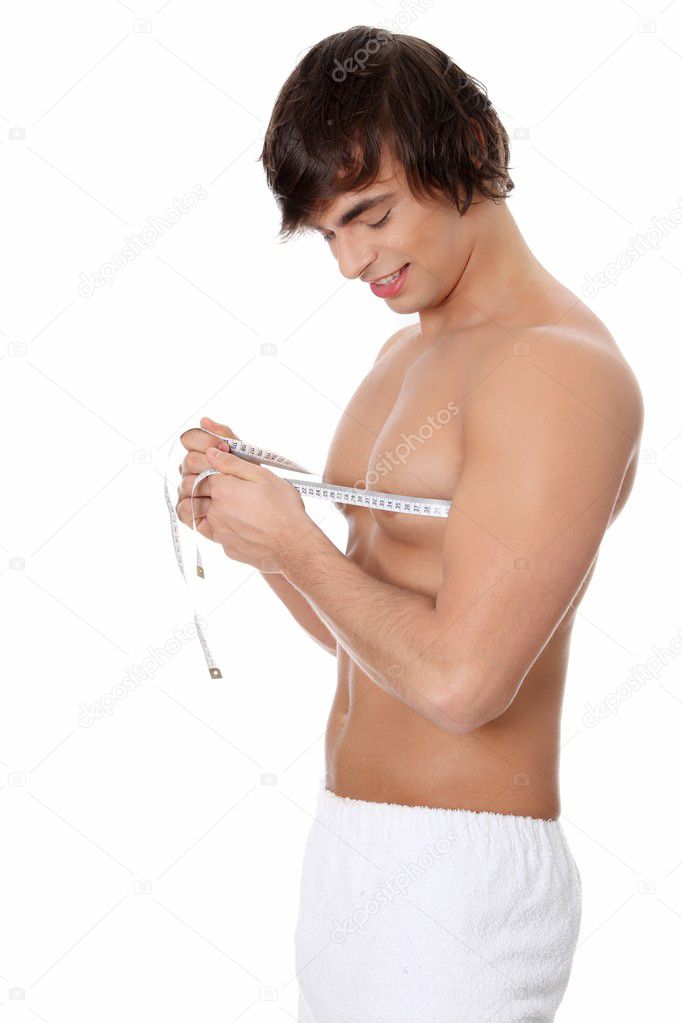 Young man's measuring himself.