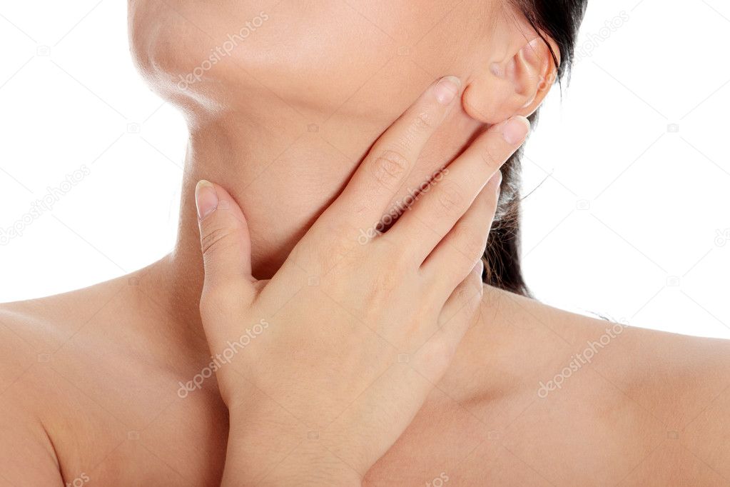 Young woman touching her throat - pain.