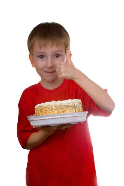 Lycklig pojke med en tårta — Stockfoto